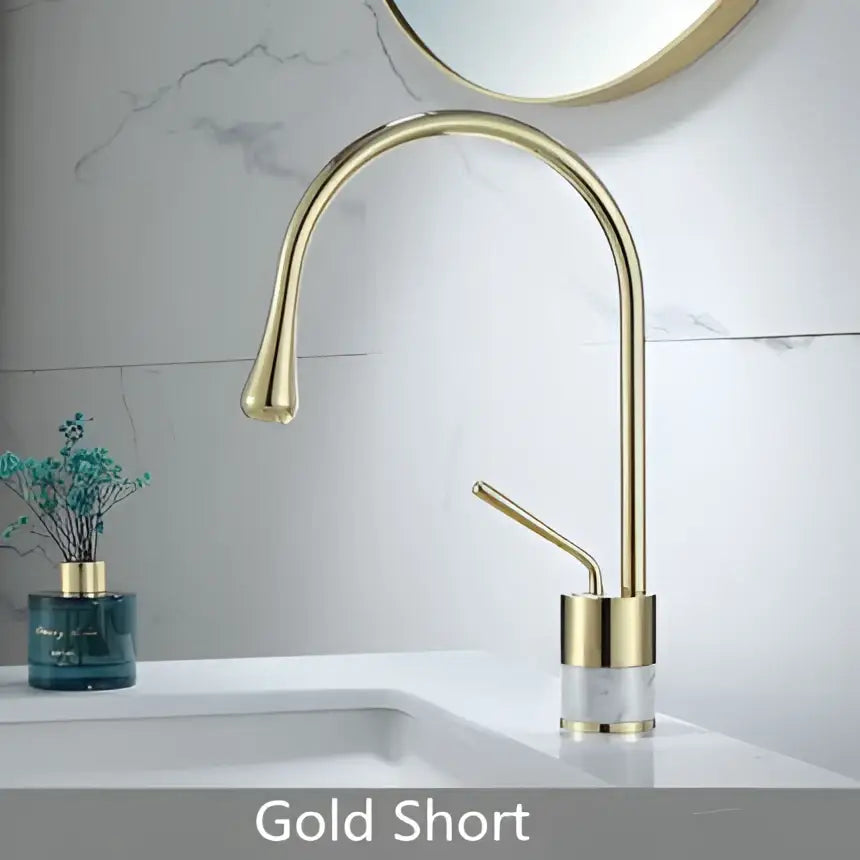 Modern brushed gold brass bathroom sink faucet with a sleek curved spout and minimalist design in brushed gold finish