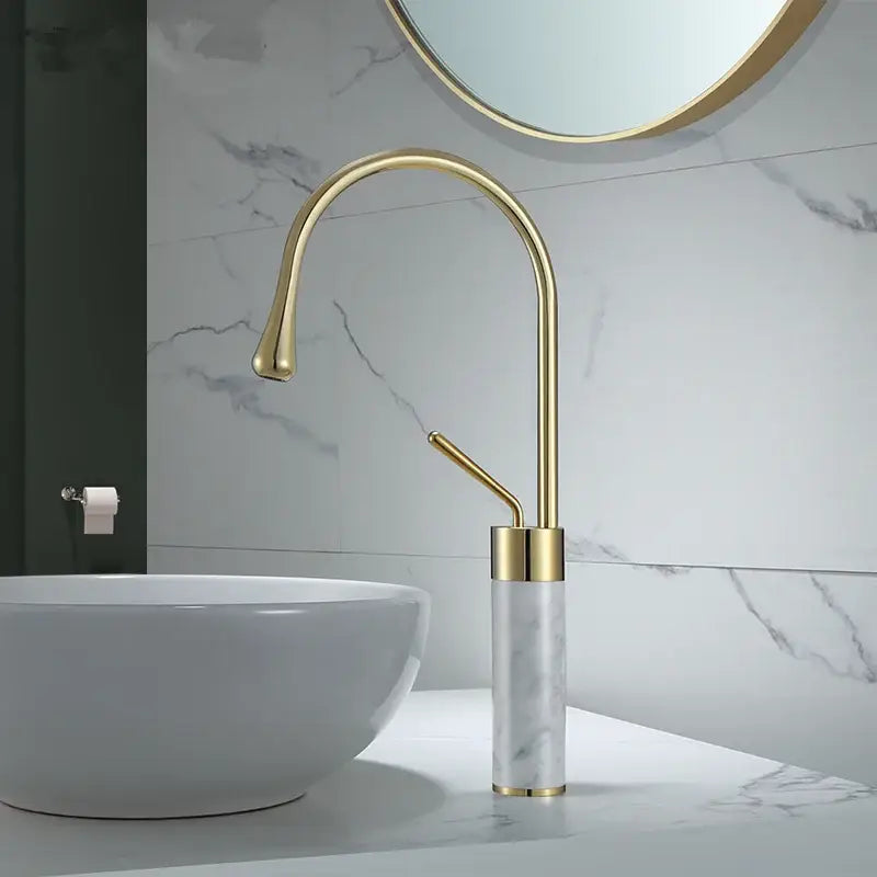 Modern brushed gold bathroom sink faucet with gold brass finish and marble-patterned cylindrical base and curved spout