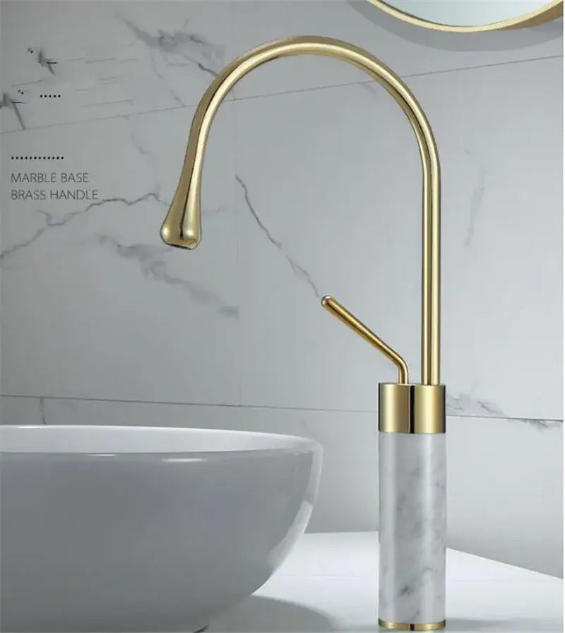Modern brushed gold bathroom sink faucet with gold brass curved spout and marble base in brushed gold brass finish