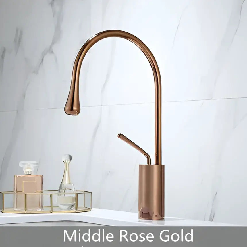 Modern brushed gold brass bathroom sink faucet with a sleek curved spout and cylindrical base in rose gold