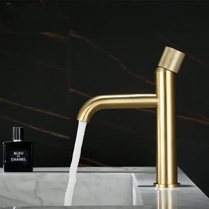 Modern brushed gold basin faucet with textured knurled handle and sleek cylindrical spout decorbites brushed gold
