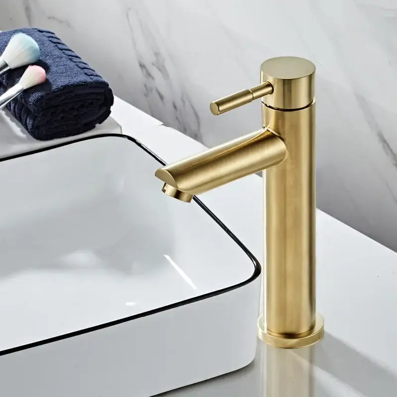 Modern brushed gold basin faucet with single handle mixer tap featuring a sleek cylindrical design and decorbites brushed gold finish