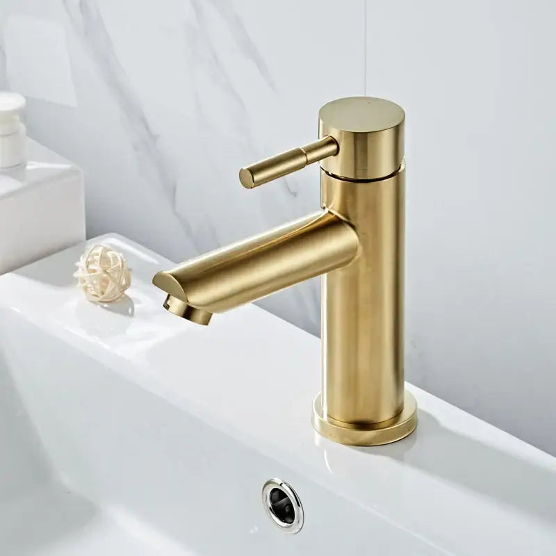 Modern brushed gold basin faucet with single handle mixer in brushed metal finish by decorbites for bathroom use