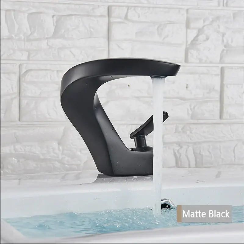 Matte black modern basin faucet with sleek curved design complementing decorbites brushed gold mixer tap bathroom decor