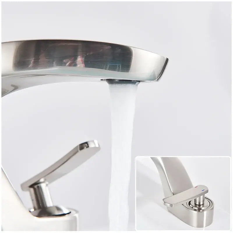 Modern chrome-finished basin faucet with waterfall design and single lever handle contrasting decorbites brushed gold tap