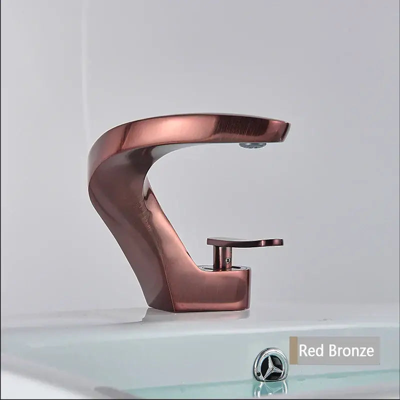 Modern brushed gold basin faucet with red bronze finish and sleek curved design from decorbites brushed gold collection