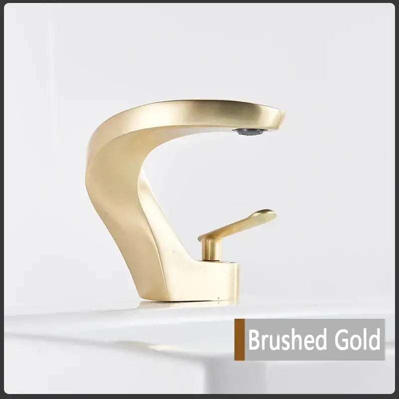 Modern brushed gold basin faucet with sleek curved design single lever mixer tap by decorbites for bathroom use