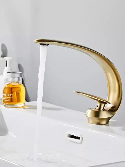 Modern brushed gold basin faucet with sleek curved design, decorbites brushed gold finish for stylish bathroom sink fixture