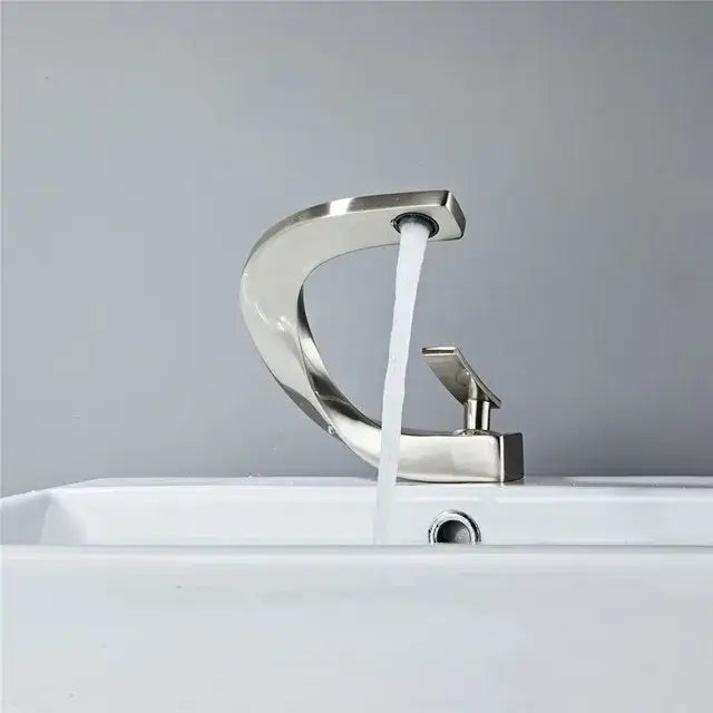 Modern brushed stainless steel basin faucet with sleek curved design and rectangular handle for decorbites basin faucet