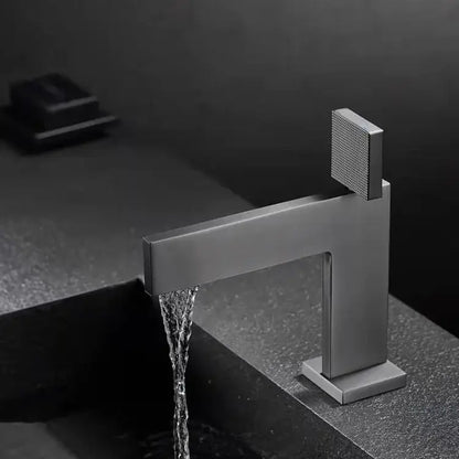 Modern matte black basin faucet with square textured handle and sleek rectangular spout decorbites brushed gold style