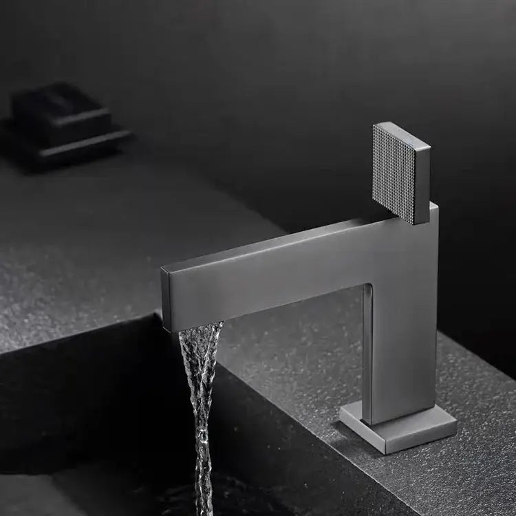 Modern matte black basin faucet with square textured handle and sleek rectangular spout decorbites brushed gold style