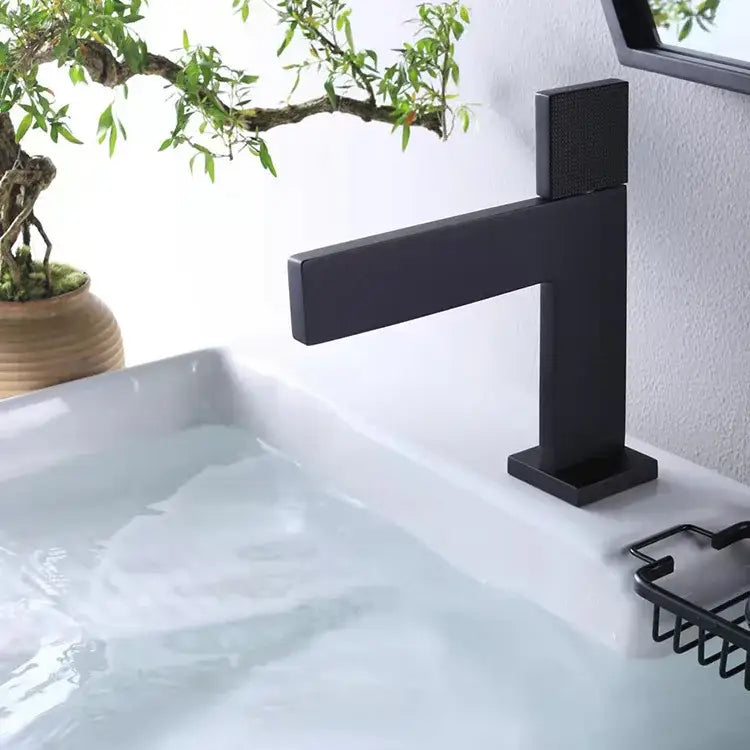 Modern matte black basin faucet with minimalist rectangular design and textured square spout for decorbites brushed gold collection