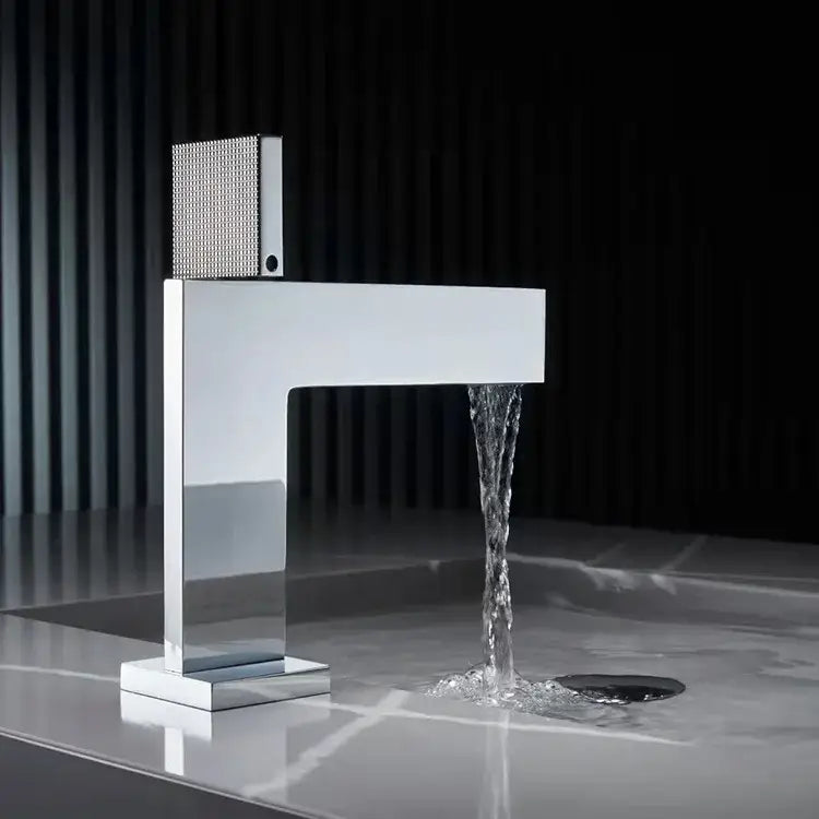Modern brushed gold basin faucet with a chrome rectangular spout and textured decorbites brushed gold square handle