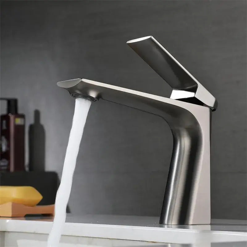 Modern brushed gold basin faucet with sleek angular design and waterfall spout by decorbites brushed gold