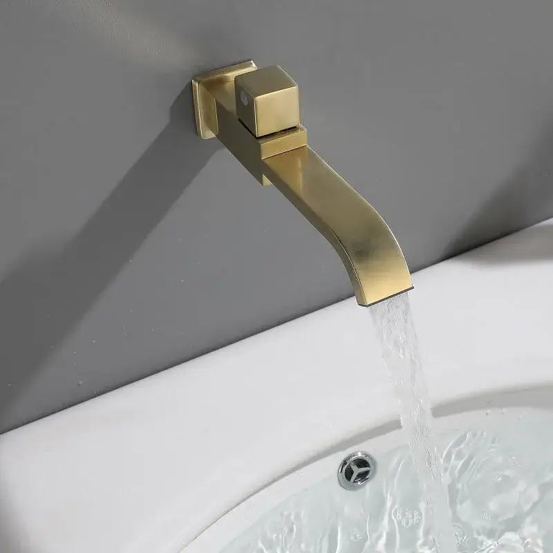 Modern brushed gold basin faucet set featuring a gold-toned basin faucet with square handle and sleek curved spout