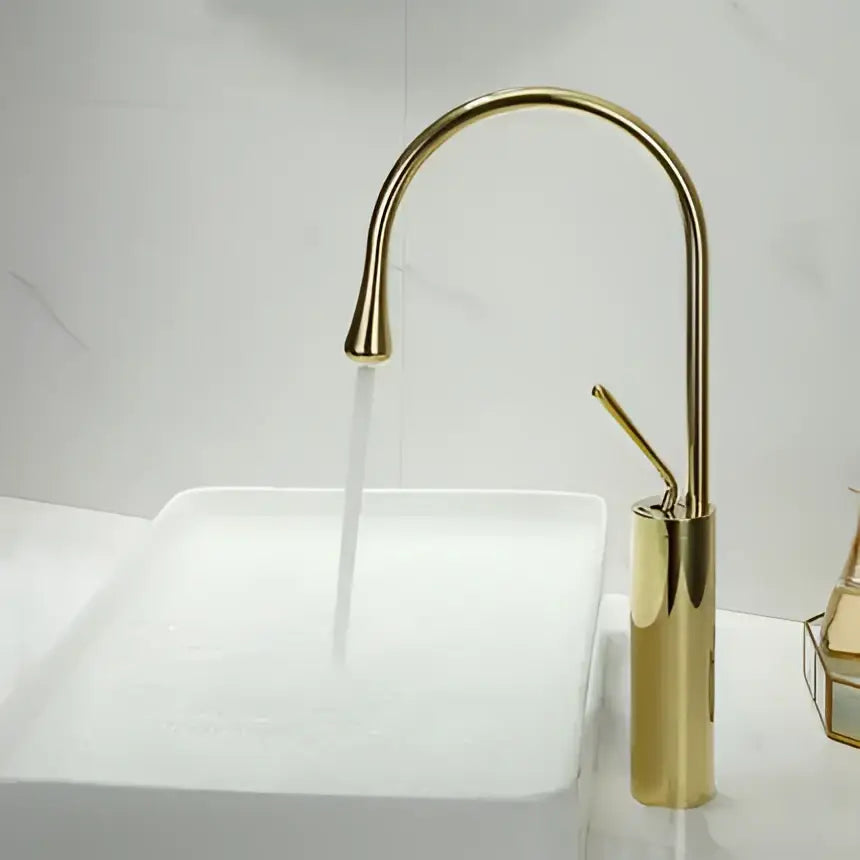 Modern brushed gold basin faucet with swivel curved spout and cylindrical base in sleek decorbites brushed gold finish