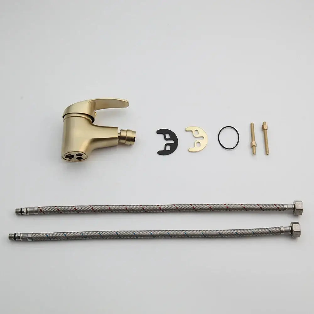 Modern brushed gold basin mixer tap with sleek three-hole spout and spray head in a brushed gold finish