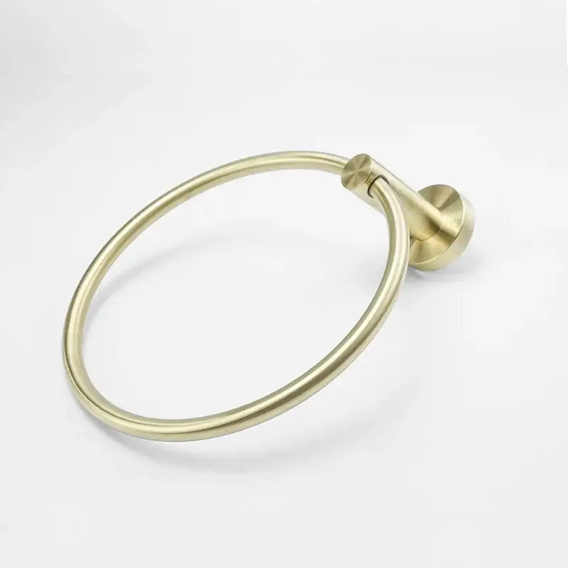 Brass-finished circular towel ring with sleek minimalist design and smooth edges in modern brushed gold bath hardware set