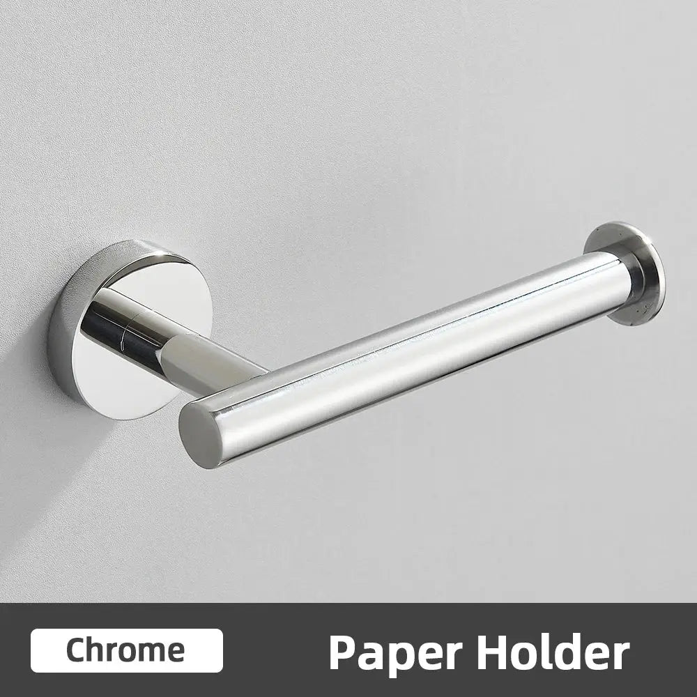 Chrome finished toilet paper holder with sleek cylindrical design in modern brushed gold bathroom accessories set stainless steel bathroom