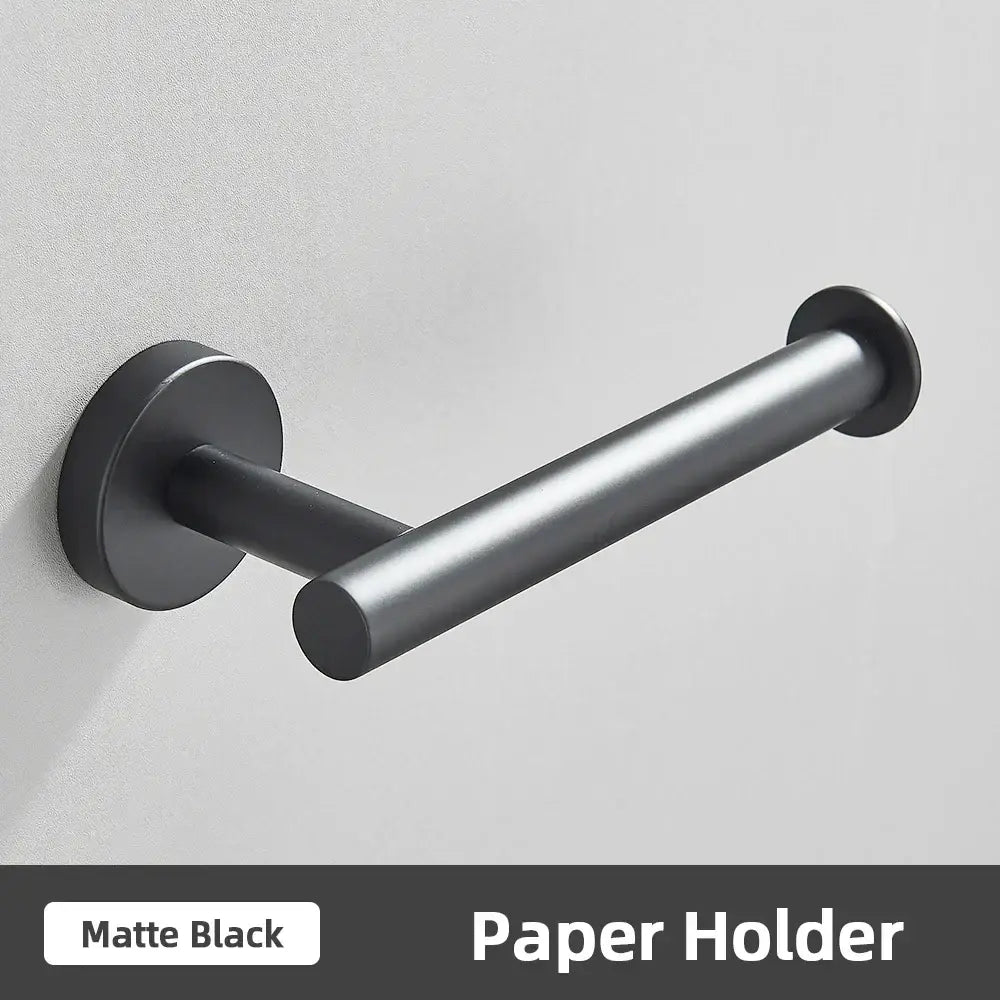 Matte black metal toilet paper holder with sleek modern design part of brushed gold bathroom accessories set stainless steel