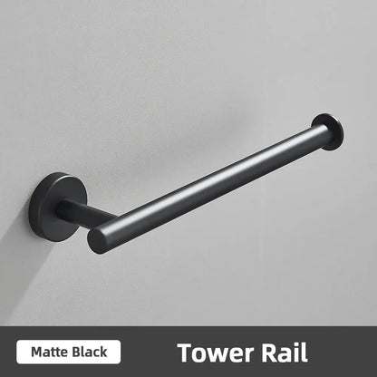 Matte black tower rail with sleek cylindrical design and minimalist mounting hardware for brushed gold bathroom accessories set