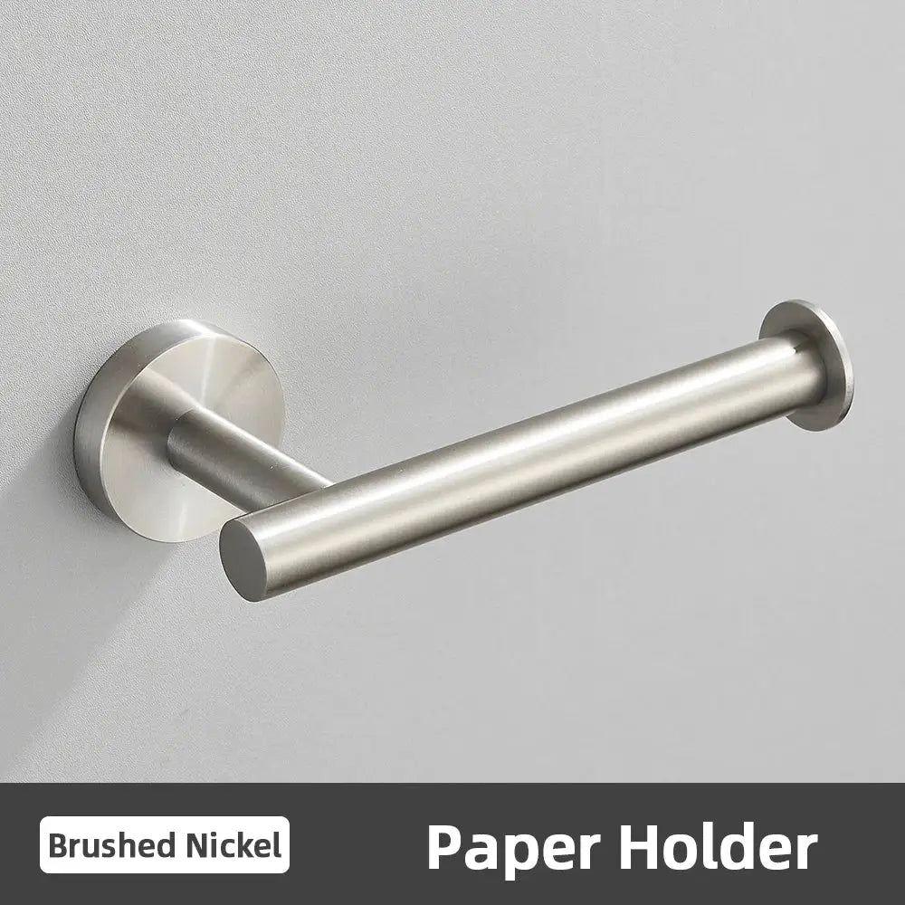 Brushed nickel paper holder with sleek cylindrical design and circular mounting plate in modern brushed gold bathroom accessories set stainless steel bathroom accessories
