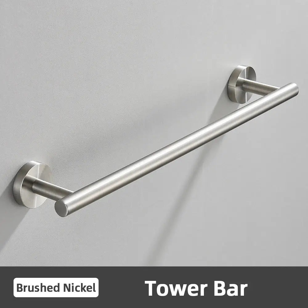 Brushed nickel tower bar with sleek cylindrical design and polished metal finish in modern brushed gold bathroom accessories set