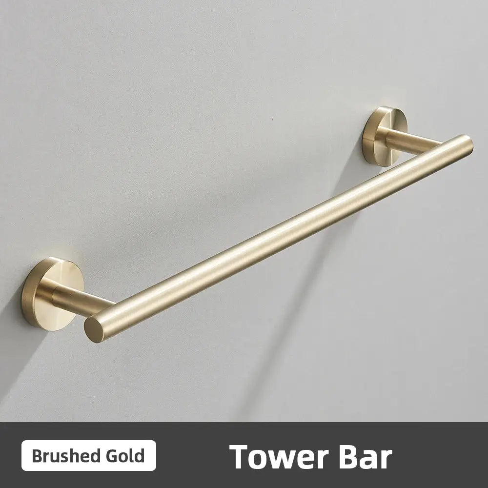 Brushed gold stainless steel tower bar towel rack with sleek cylindrical design in modern bathroom accessories set