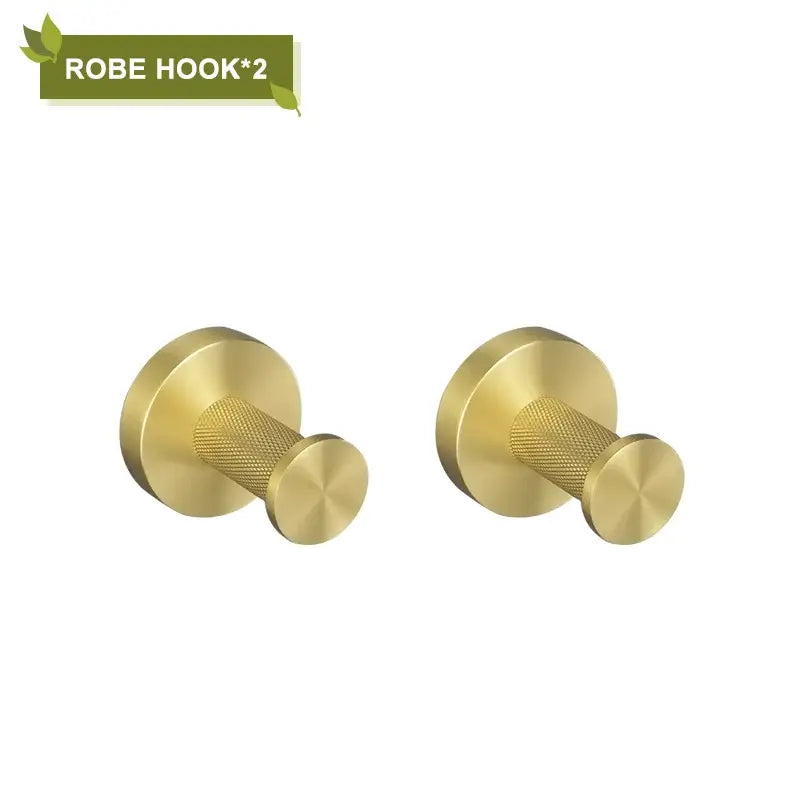 Pair of brushed gold robe hooks with textured cylindrical shafts and circular mounting plates from decorbites bathroom accessories set