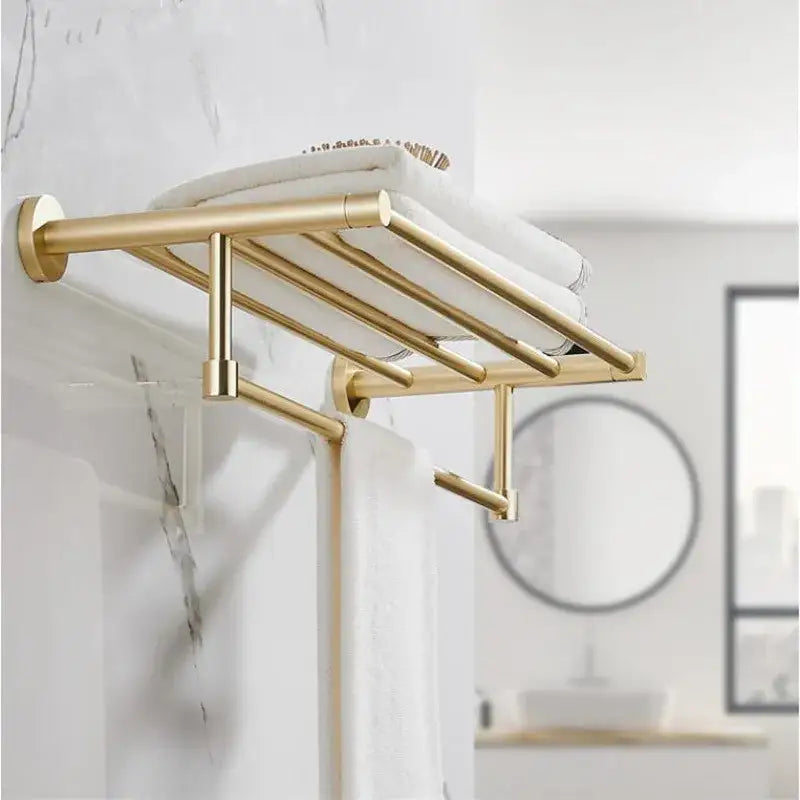 Modern brushed gold metal towel rack with multiple bars in bathroom hardware set for organized towel storage
