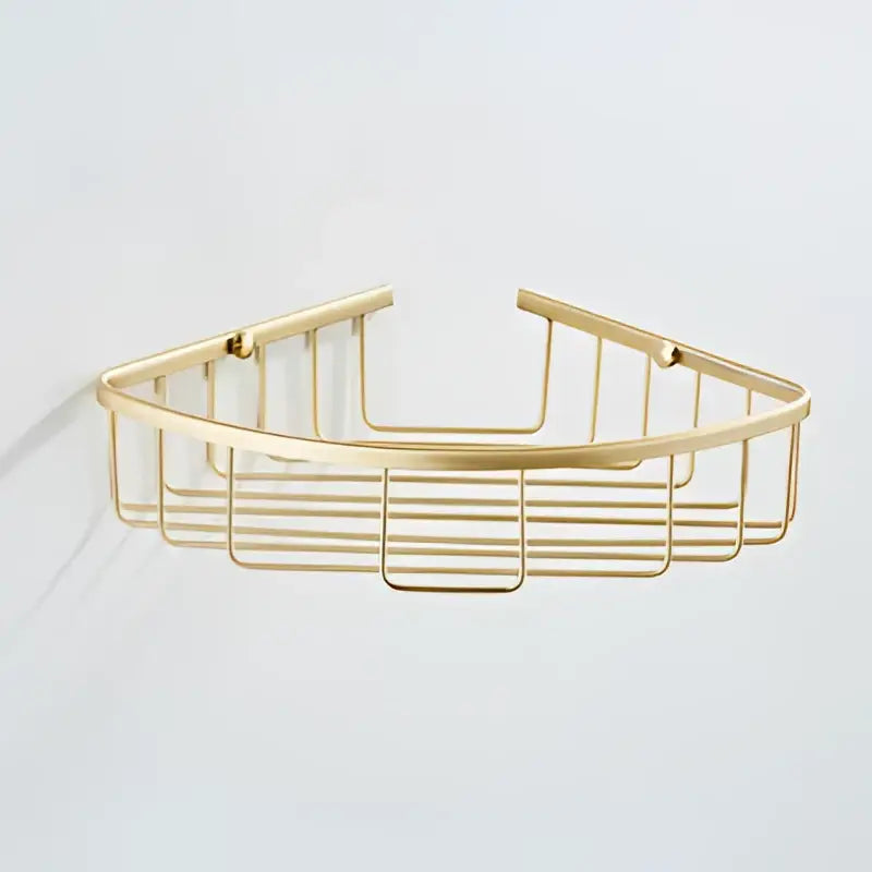 Modern brushed gold bathroom hardware set featuring a gold-toned metal corner shower caddy with sleek design