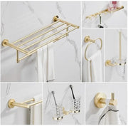 Modern brushed gold bathroom hardware set with a multi bar gold-toned towel rack featuring a sleek design