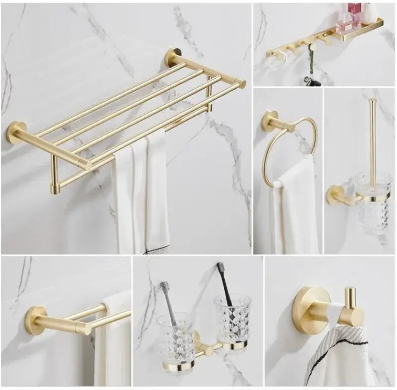 Modern brushed gold bathroom hardware set with a multi bar gold-toned towel rack featuring a sleek design