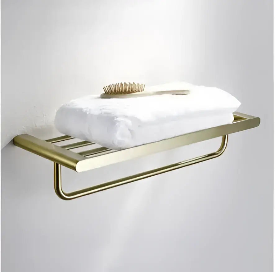 Modern brushed gold hardware set featuring a gold-toned metal towel rack with horizontal slats and rounded edges by decorbites