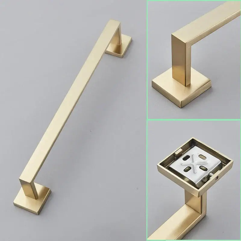 Modern brushed gold hardware set featuring a rectangular bar towel rack with square brackets and a sleek metallic finish