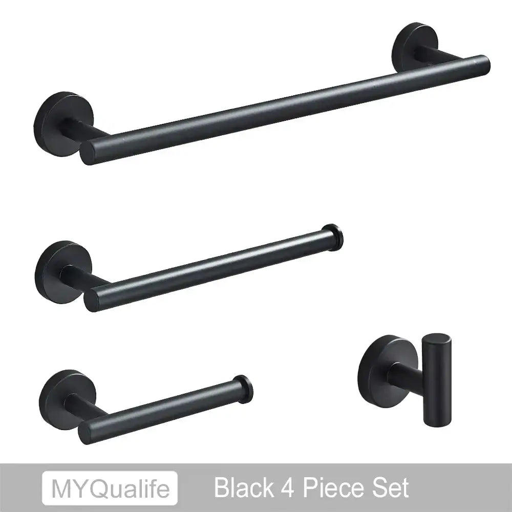 Black matte bathroom hardware set with towel bar and toilet paper holder complementing decorbites brushed gold style