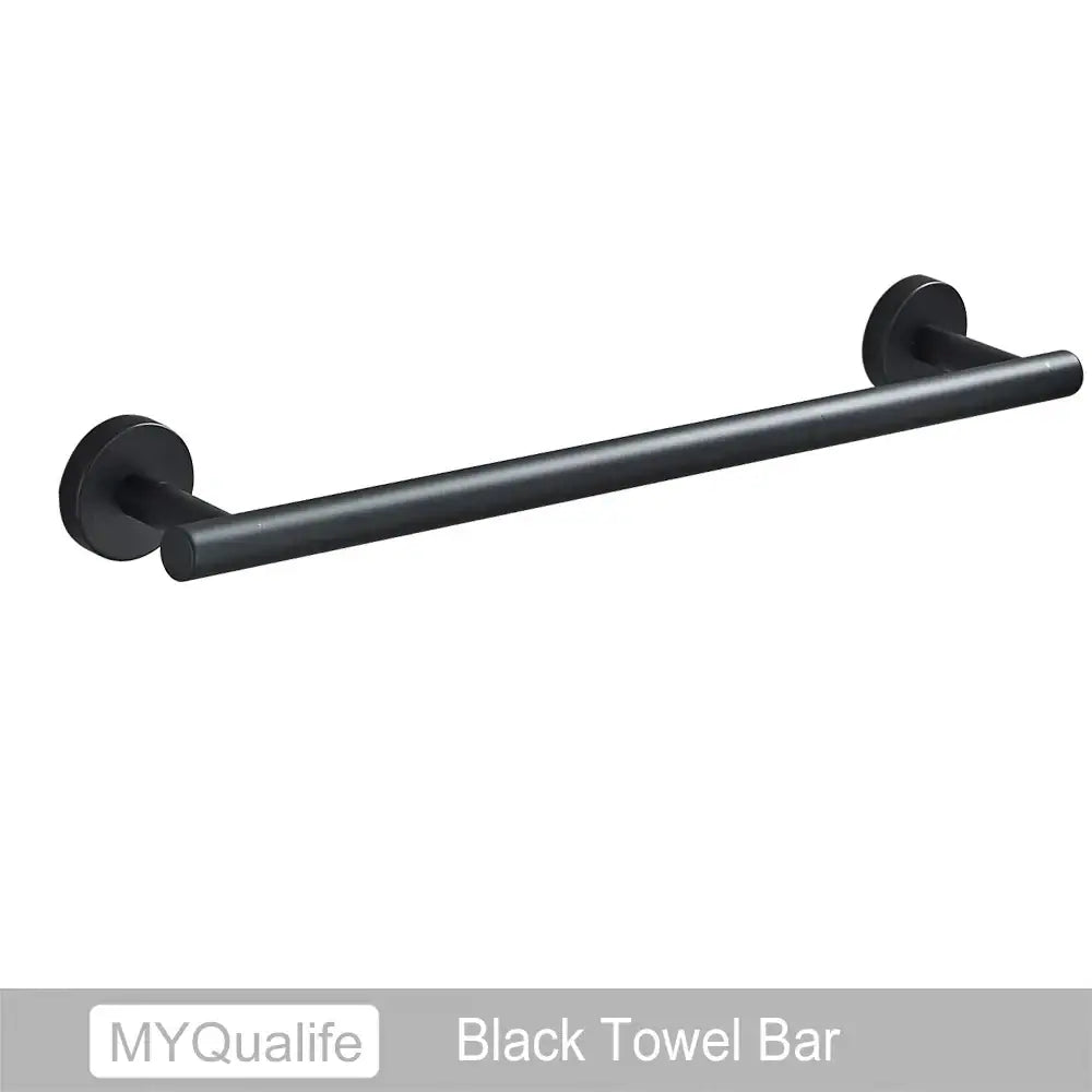 Black matte towel bar with sleek cylindrical design and circular mounts in modern decorbites brushed gold bathroom hardware set