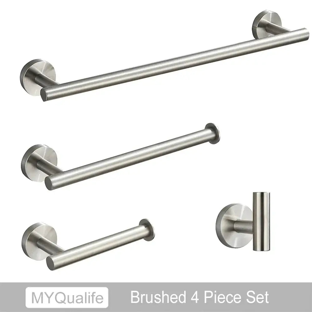Modern brushed gold bathroom hardware set with towel bar toilet paper holder and smaller bars in brushed stainless steel