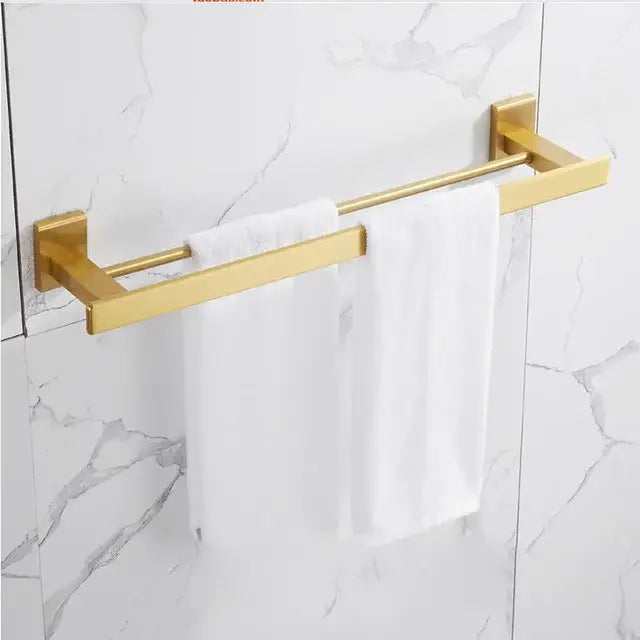Modern brushed gold bathroom set double-bar towel rack with sleek design mounted on marble wall by decorbites brushed gold