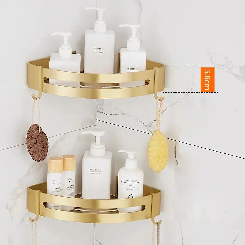 Modern brushed gold bathroom set featuring a gold-colored two-tiered corner shower caddy with integrated hooks decorbites brushed gold