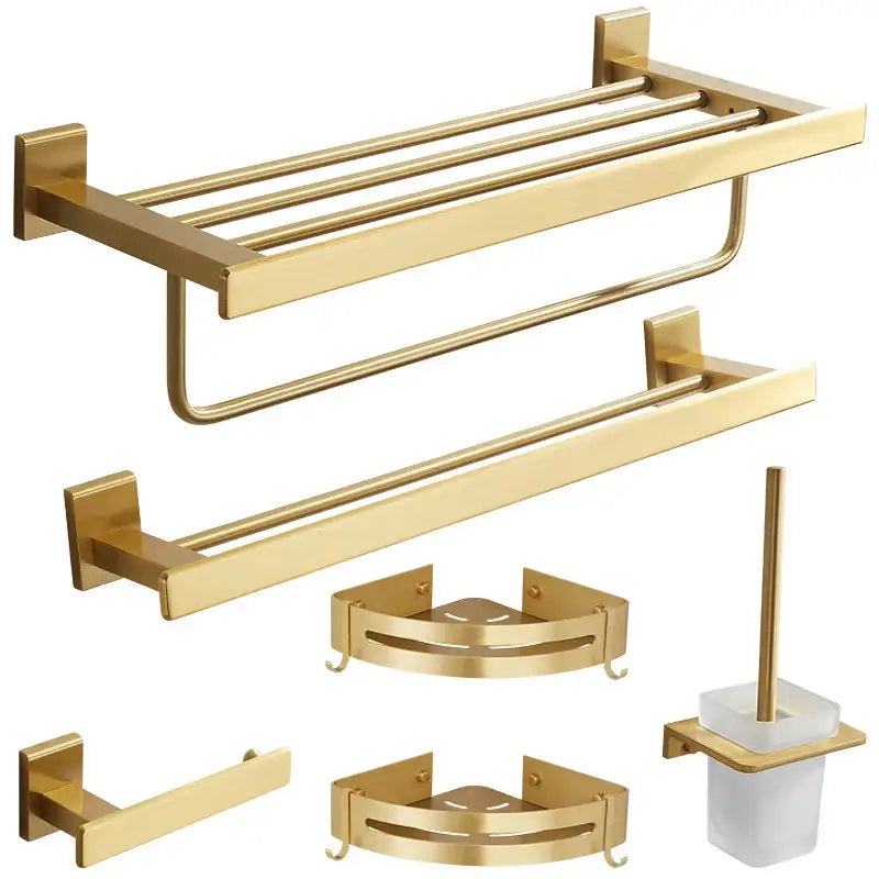 Modern brushed gold bathroom set with sleek decorbites brushed gold hardware including towel racks and shelves