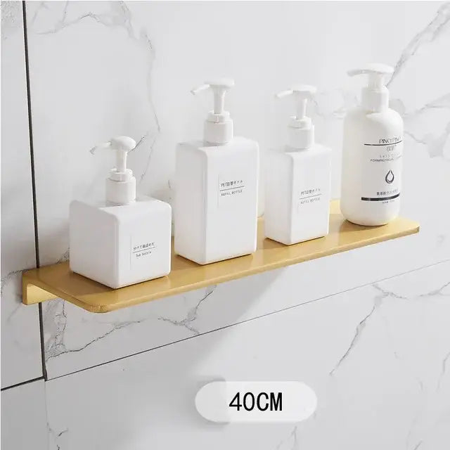 White rectangular refillable soap dispensers with pump tops on a brushed gold wooden shelf in bathroom set decorbites brushed gold