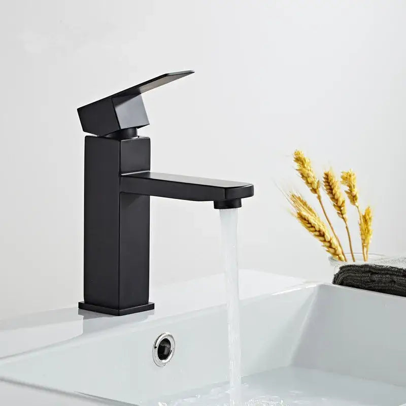 Modern brushed gold black rectangular basin tap featuring a black matte angular faucet with a sleek minimalist design