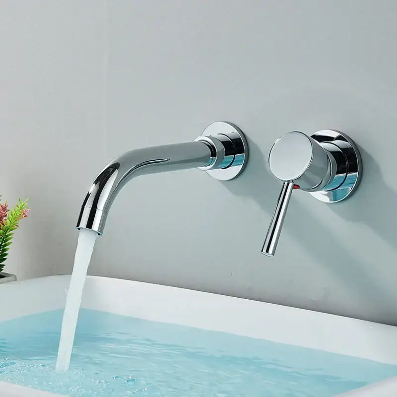 Chrome-finished wall mounted basin faucet with sleek curved spout and cylindrical handle for modern bathroom use