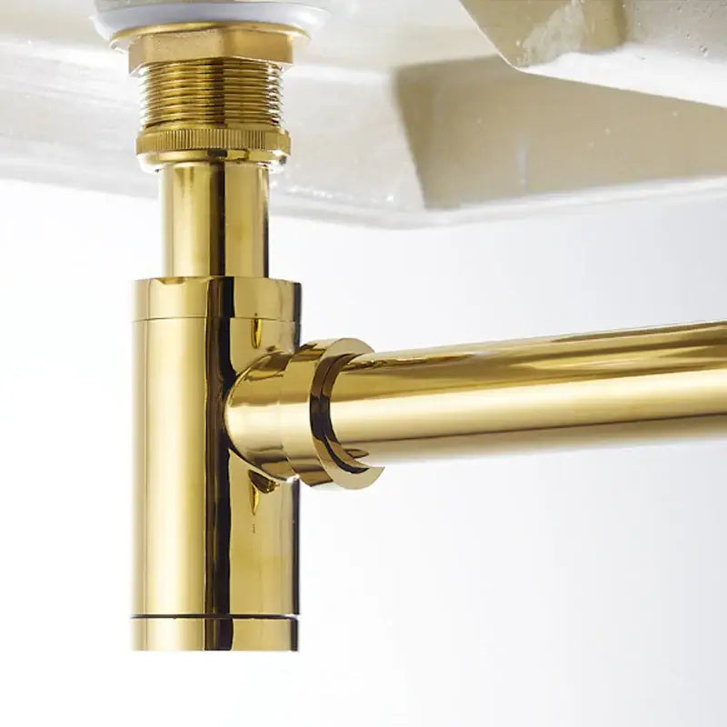 Modern brushed gold brass basin p-trap with polished metallic finish and threaded connections for decorbites brass basin