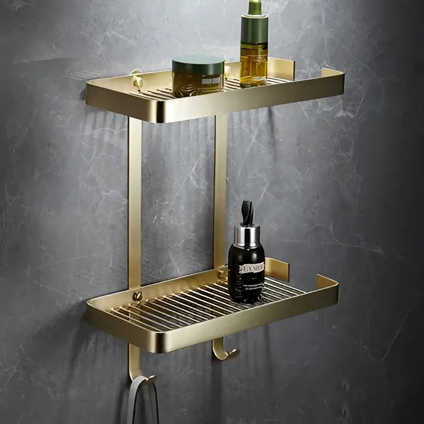 Modern brushed gold brass bath hardware set featuring a gold double-tier bathroom shelf with perforated metal trays
