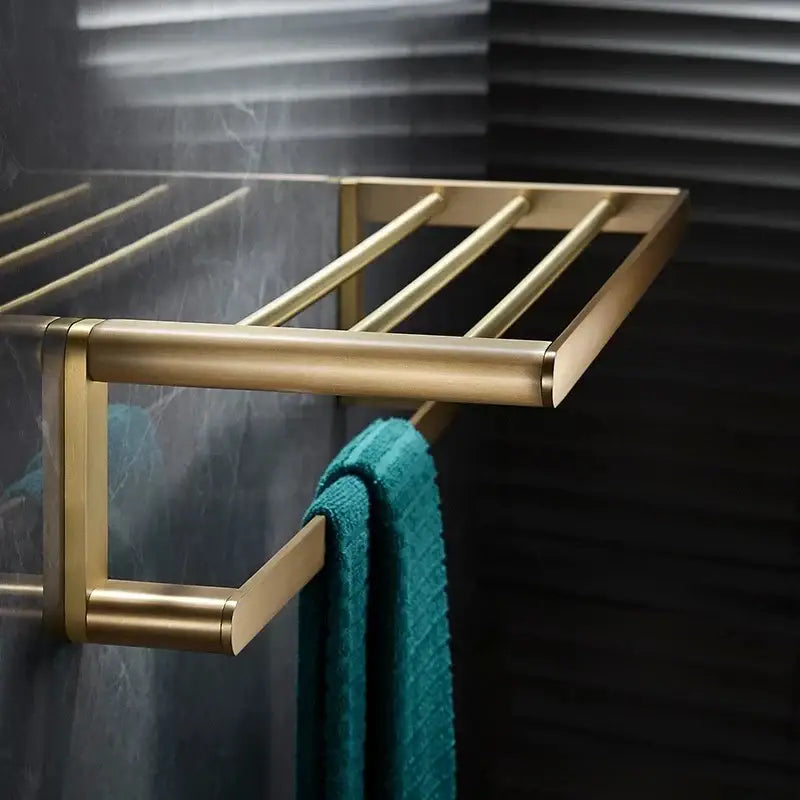 Modern brushed gold brass bath hardware set towel rack with sleek horizontal bars in a bath hardware set design
