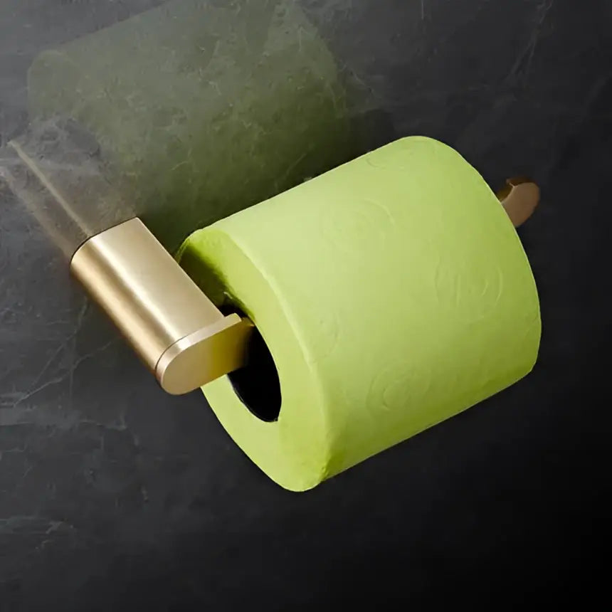 A vibrant lime green toilet paper roll on a modern brushed gold brass bath hardware set holder