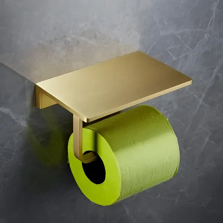 Modern brushed gold brass metal toilet paper holder with sleek rectangular shelf design in bath hardware set