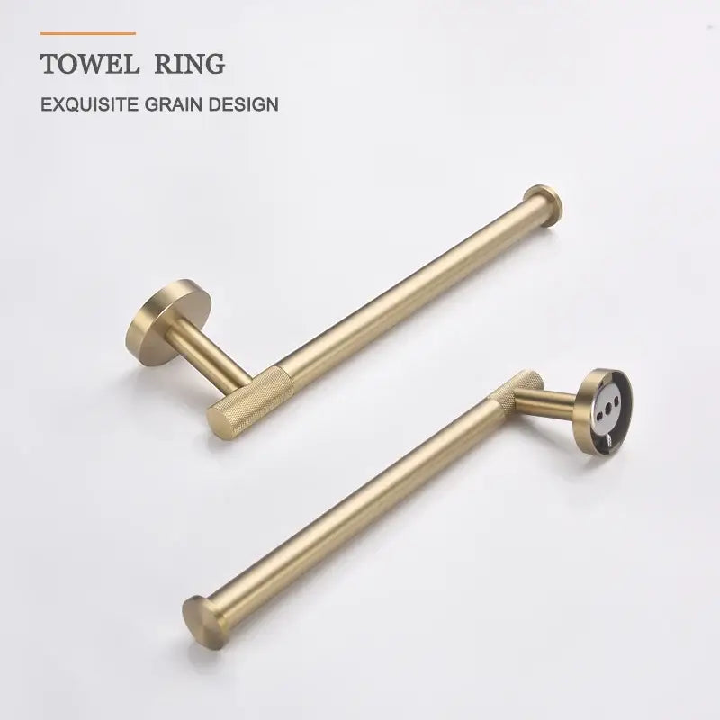 Brass-finished towel ring with elegant grain design and textured grip in a modern brushed gold bathroom accessories set